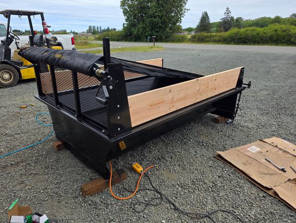 Insert fitted with wood side panels, cab guard and tarp roller
